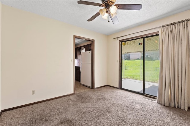 120 Highland Rd, Lansing, KS 66043 - empty room with light carpet, a textured ceiling, a ceiling fan, and baseboards