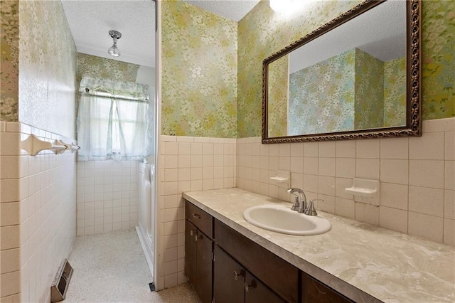 120 Highland Rd, Lansing, KS 66043 - full bath with wallpapered walls, a wainscoted wall, vanity, and tile walls
