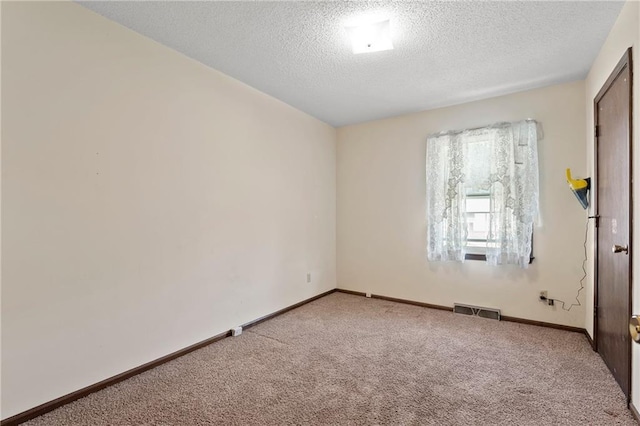 120 Highland Rd, Lansing, KS 66043 - carpeted empty room with a textured ceiling and baseboards