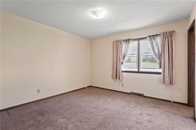 120 Highland Rd, Lansing, KS 66043 - unfurnished room featuring carpet flooring, a textured ceiling, and baseboards