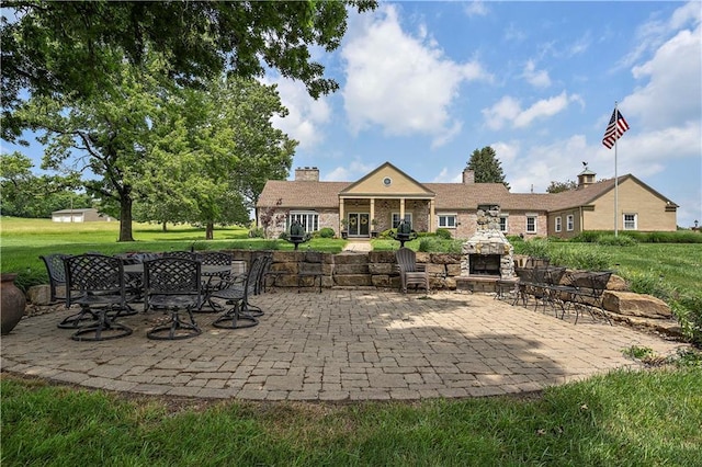 450 Ruth Ewing Rd, Liberty, MO 64068 - view of patio / terrace featuring an outdoor stone fireplace