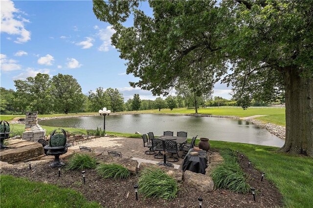 450 Ruth Ewing Rd, Liberty, MO 64068 - view of green lawn with a water view and a patio area