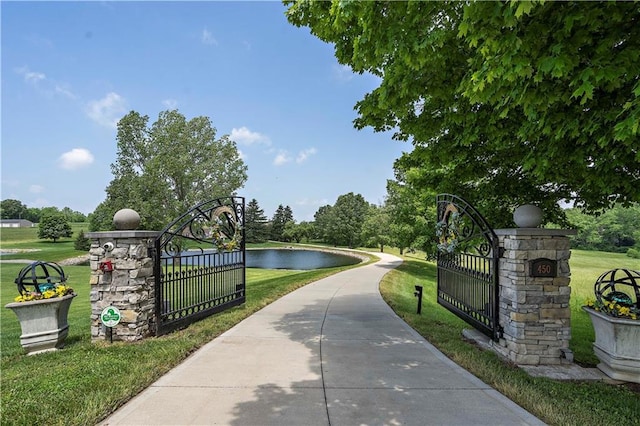 450 Ruth Ewing Rd, Liberty, MO 64068 - view of property's community featuring a lawn, a water view, and a gate
