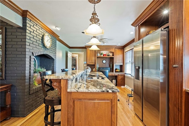 450 Ruth Ewing Rd, Liberty, MO 64068 - kitchen with stainless steel fridge, open shelves, light wood-style flooring, ornamental molding, and light stone counters