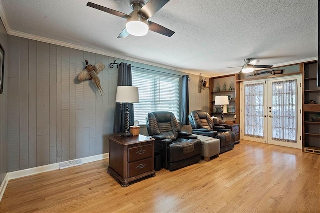 450 Ruth Ewing Rd, Liberty, MO 64068 - office space featuring ceiling fan, crown molding, french doors, light wood-type flooring, and a textured ceiling