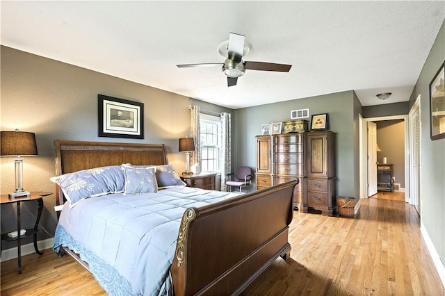 450 Ruth Ewing Rd, Liberty, MO 64068 - bedroom with light wood-type flooring, baseboards, and ceiling fan