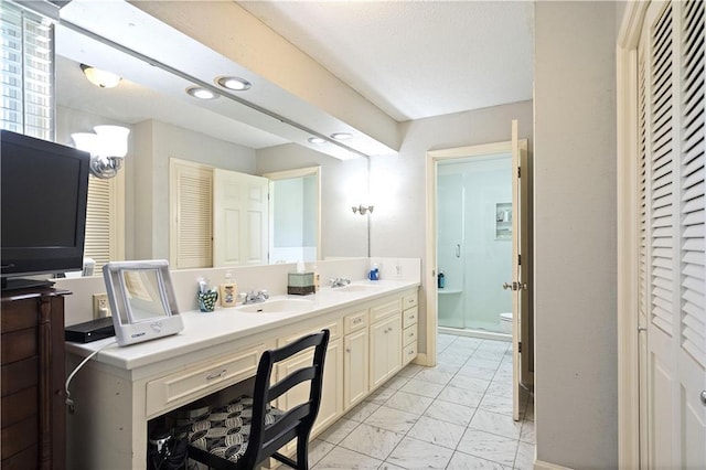 450 Ruth Ewing Rd, Liberty, MO 64068 - full bathroom featuring a closet, marble finish flooring, toilet, double vanity, and recessed lighting