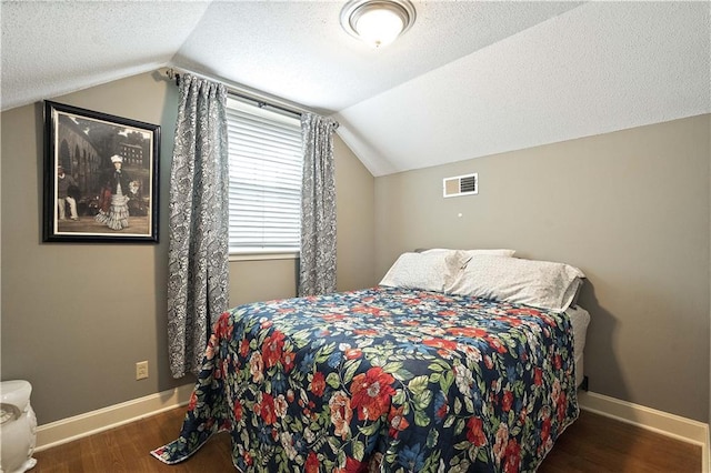 450 Ruth Ewing Rd, Liberty, MO 64068 - bedroom with vaulted ceiling, wood finished floors, a textured ceiling, and baseboards