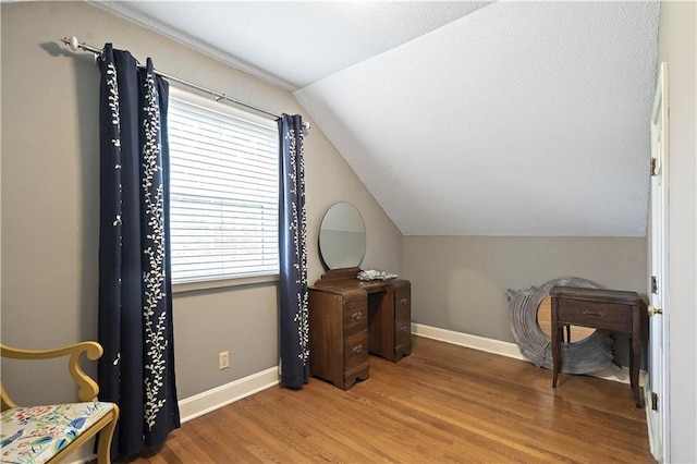 450 Ruth Ewing Rd, Liberty, MO 64068 - home office with lofted ceiling, wood finished floors, healthy amount of natural light, and baseboards