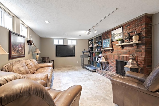 450 Ruth Ewing Rd, Liberty, MO 64068 - living area featuring a textured ceiling, a fireplace, built in shelves, and baseboards