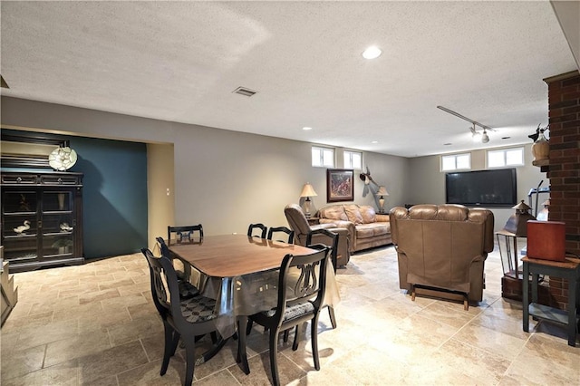 450 Ruth Ewing Rd, Liberty, MO 64068 - dining space with a textured ceiling, track lighting, and recessed lighting
