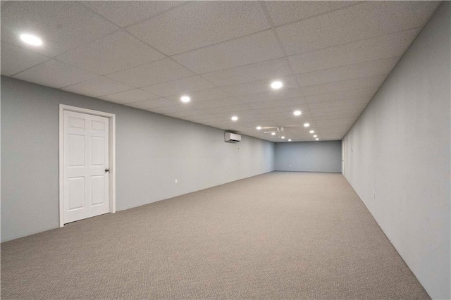450 Ruth Ewing Rd, Liberty, MO 64068 - finished basement featuring carpet, a wall unit AC, a paneled ceiling, and recessed lighting