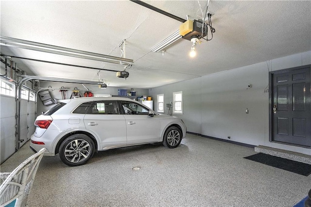 450 Ruth Ewing Rd, Liberty, MO 64068 - garage with a garage door opener and baseboards