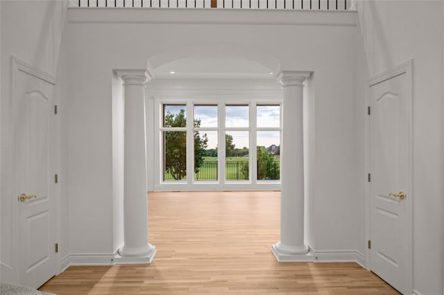 14005 Dearborn St, Overland Park, KS 66223 - hallway with ornate columns, wood finished floors, and arched walkways