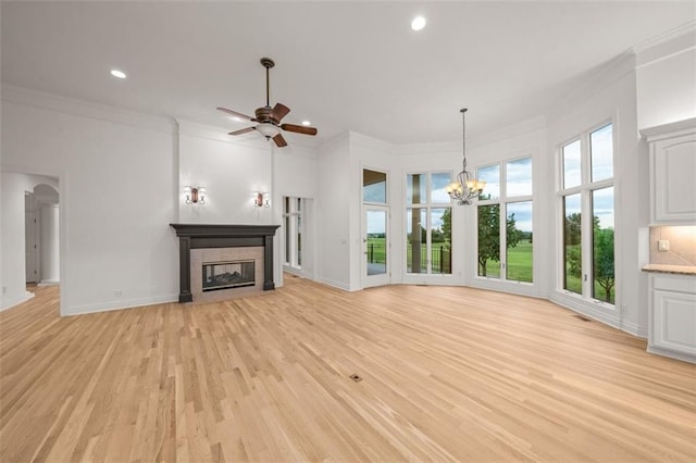 14005 Dearborn St, Overland Park, KS 66223 - unfurnished living room with ornamental molding, light wood-type flooring, a fireplace, a chandelier, and recessed lighting