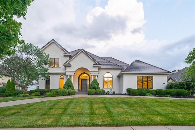 14005 Dearborn St, Overland Park, KS 66223 - french provincial home with a front lawn and stucco siding