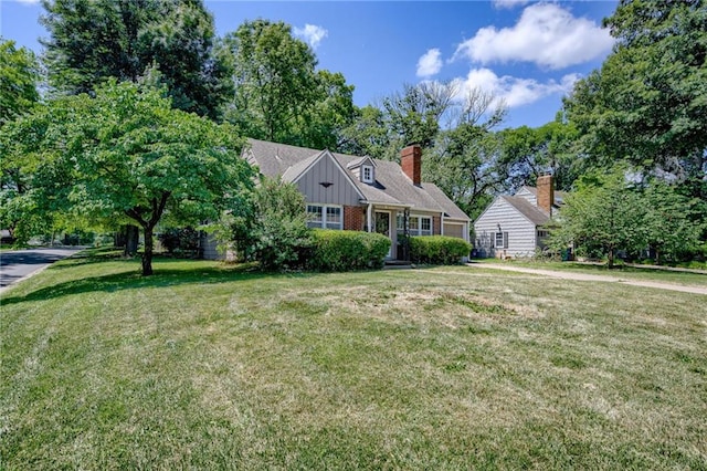 5301 Sycamore Dr, Roeland Park, KS 66205 - view of front of home with a front yard and a chimney