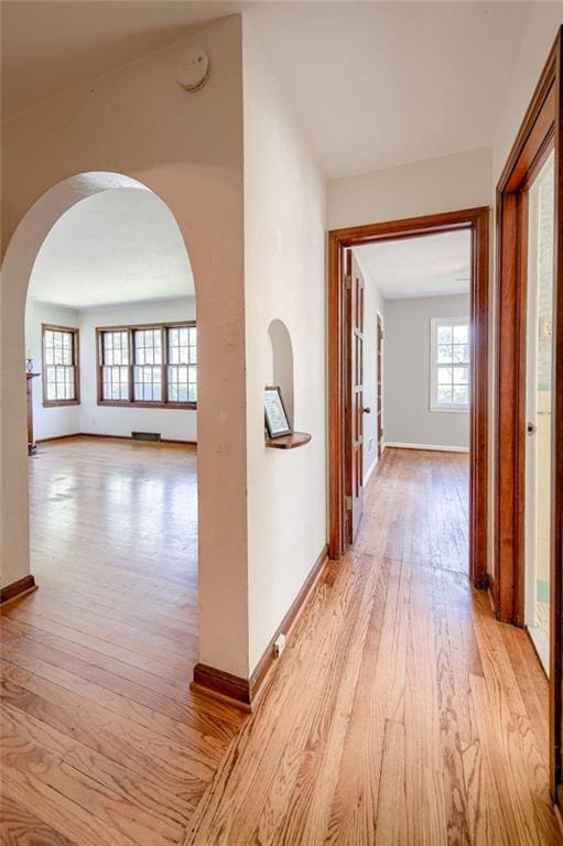 5301 Sycamore Dr, Roeland Park, KS 66205 - corridor featuring light wood-style floors and arched walkways