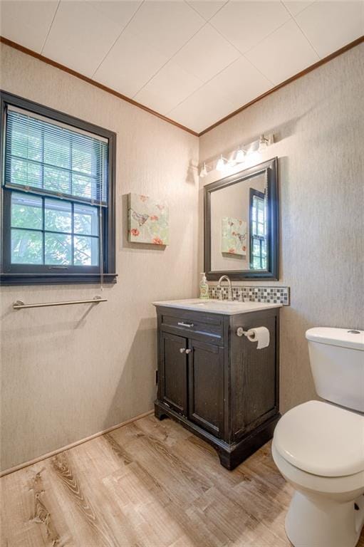 5301 Sycamore Dr, Roeland Park, KS 66205 - half bath with ornamental molding, vanity, and wood finished floors