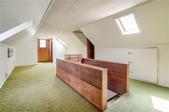 5301 Sycamore Dr, Roeland Park, KS 66205 - bonus room featuring a skylight, carpet floors, and vaulted ceiling