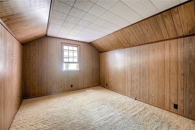 5301 Sycamore Dr, Roeland Park, KS 66205 - additional living space featuring carpet floors, vaulted ceiling, and wooden walls