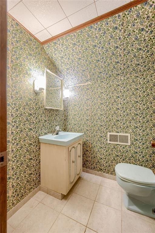 5301 Sycamore Dr, Roeland Park, KS 66205 - bathroom featuring vanity, crown molding, and tile patterned floors