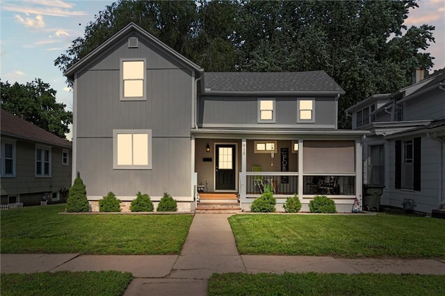 915 4th Ave, Leavenworth, KS 66048 - view of front of house with covered porch and a front yard