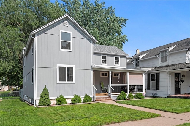 915 4th Ave, Leavenworth, KS 66048 - view of front facade featuring a porch and a front lawn