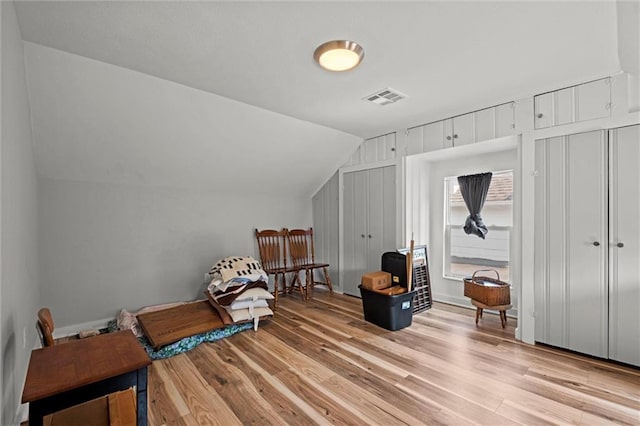 915 4th Ave, Leavenworth, KS 66048 - bonus room featuring lofted ceiling and light wood-type flooring