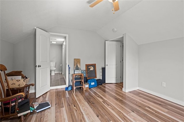 915 4th Ave, Leavenworth, KS 66048 - bonus room with lofted ceiling, wood finished floors, and ceiling fan
