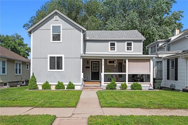 915 4th Ave, Leavenworth, KS 66048 - view of front of property with a porch, a front lawn, and a shingled roof