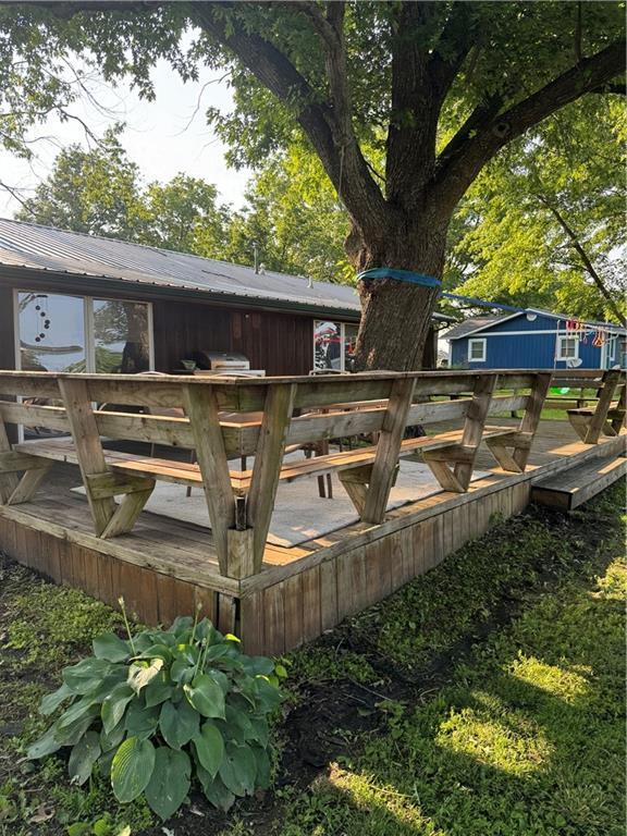 605 N Locust St, Moran, KS 66755 - wooden deck featuring a grill