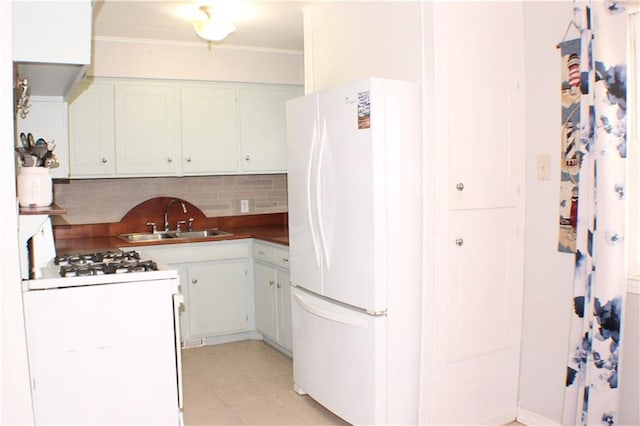 3801 N Osage St, Independence, MO 64050 - kitchen with white appliances, decorative backsplash, ornamental molding, dark countertops, and light tile patterned floors
