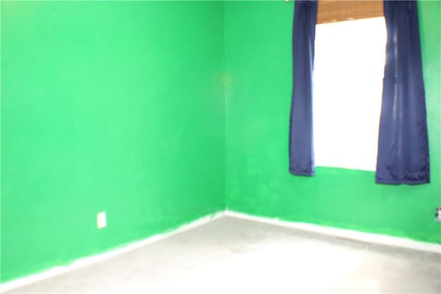 3801 N Osage St, Independence, MO 64050 - spare room with baseboards and carpet flooring