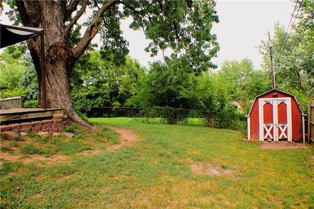 3801 N Osage St, Independence, MO 64050 - fenced backyard with a storage unit and view of scattered trees