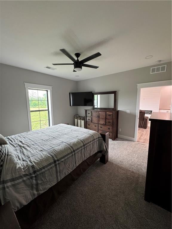 25908 E 317th Ter, Harrisonville, MO 64701 - carpeted bedroom featuring ceiling fan and baseboards