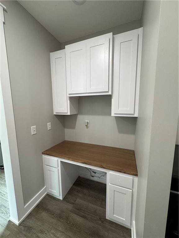 25908 E 317th Ter, Harrisonville, MO 64701 - unfurnished office with built in desk, dark wood finished floors, and baseboards