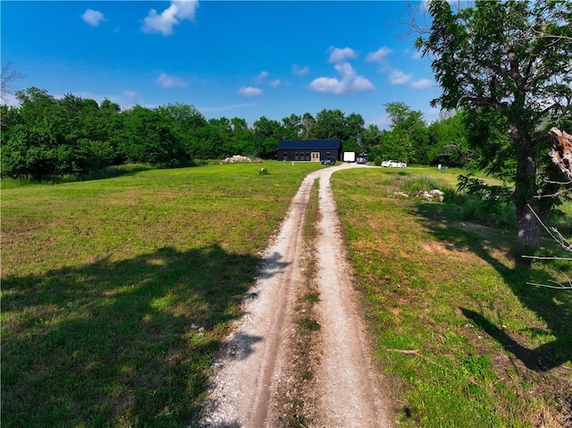 25908 E 317th Ter, Harrisonville, MO 64701 - view of dirt / gravel road featuring a forest view