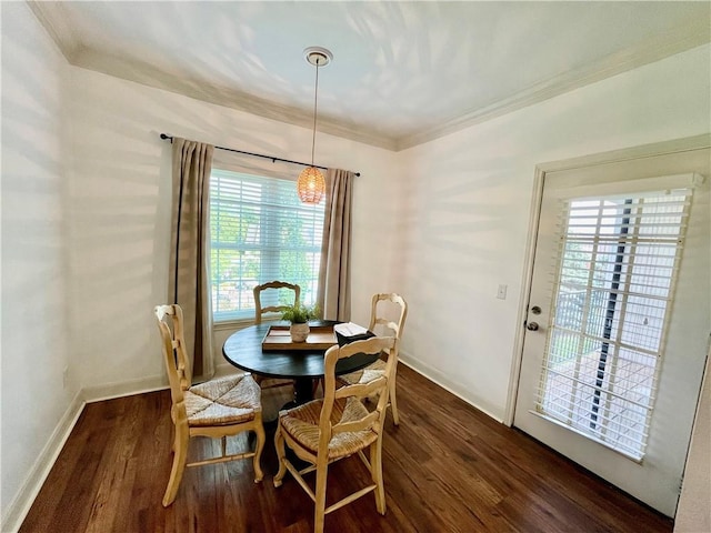 11619 Tomahawk Creek Pkwy Unit B, Leawood, KS 66211 - dining space featuring dark wood-style flooring, baseboards, crown molding, and a chandelier
