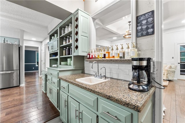 26725 S Bennett Rd, Freeman, MO 64746 - indoor wet bar with freestanding refrigerator, hardwood / wood-style flooring, tasteful backsplash, recessed lighting, and beamed ceiling