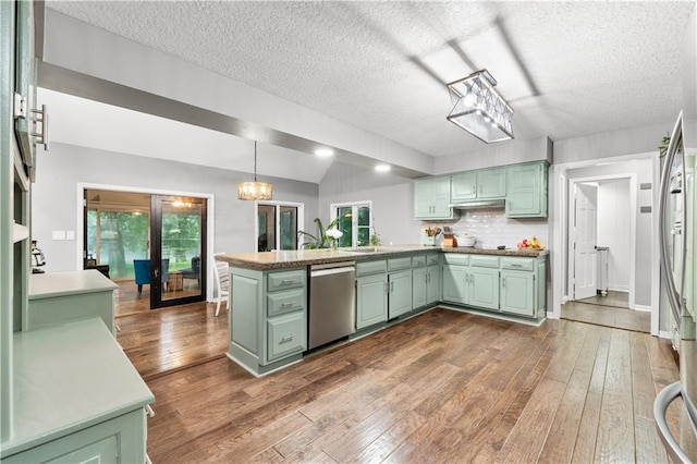 26725 S Bennett Rd, Freeman, MO 64746 - kitchen featuring green cabinetry, stainless steel appliances, a peninsula, dark wood-style floors, and healthy amount of natural light