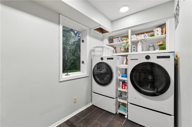 26725 S Bennett Rd, Freeman, MO 64746 - laundry area with washing machine and clothes dryer, dark wood finished floors, and baseboards