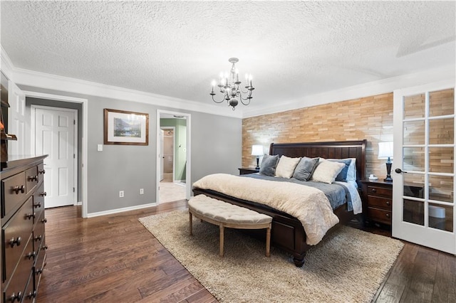 26725 S Bennett Rd, Freeman, MO 64746 - bedroom featuring a textured ceiling, a chandelier, crown molding, dark wood-style floors, and baseboards