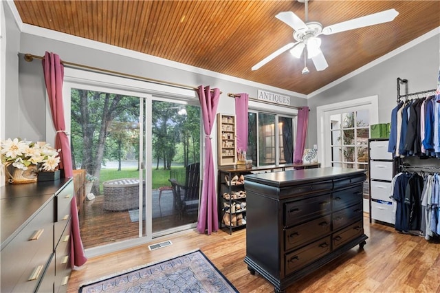 26725 S Bennett Rd, Freeman, MO 64746 - spacious closet with lofted ceiling, light wood-style floors, and a ceiling fan