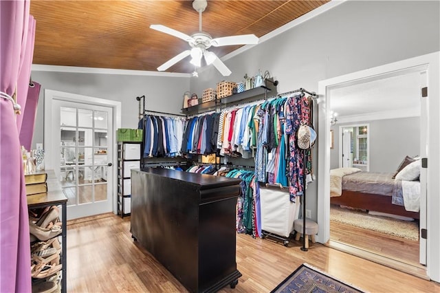 26725 S Bennett Rd, Freeman, MO 64746 - walk in closet with ceiling fan and light wood-type flooring