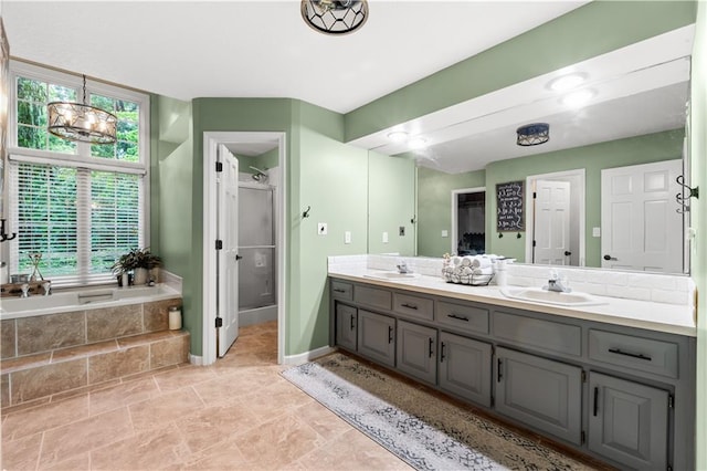 26725 S Bennett Rd, Freeman, MO 64746 - full bathroom featuring double vanity, a bath, a shower stall, and baseboards