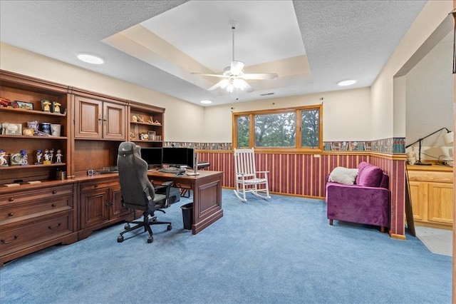 26725 S Bennett Rd, Freeman, MO 64746 - office featuring a wainscoted wall, a raised ceiling, ceiling fan, carpet flooring, and a textured ceiling
