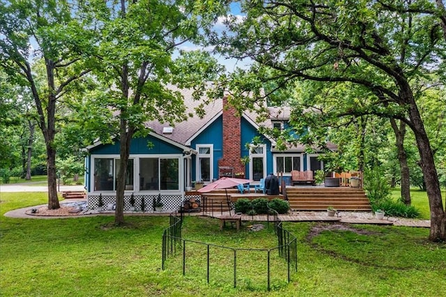 26725 S Bennett Rd, Freeman, MO 64746 - rear view of property with a sunroom, a wooden deck, and a chimney