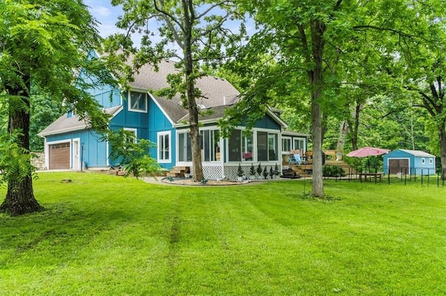 26725 S Bennett Rd, Freeman, MO 64746 - back of property with a sunroom and board and batten siding