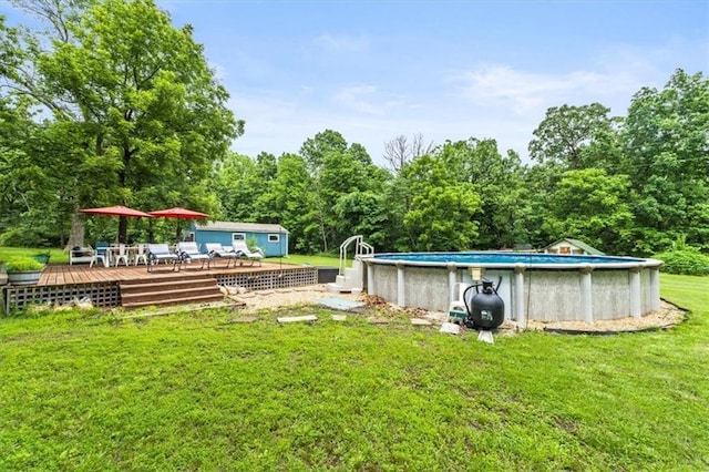 26725 S Bennett Rd, Freeman, MO 64746 - view of green lawn featuring a wooden deck, an outdoor pool, and an outdoor structure